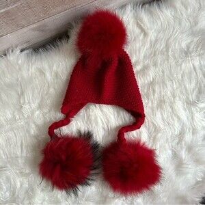 Children’s knitted hat with three pompoms